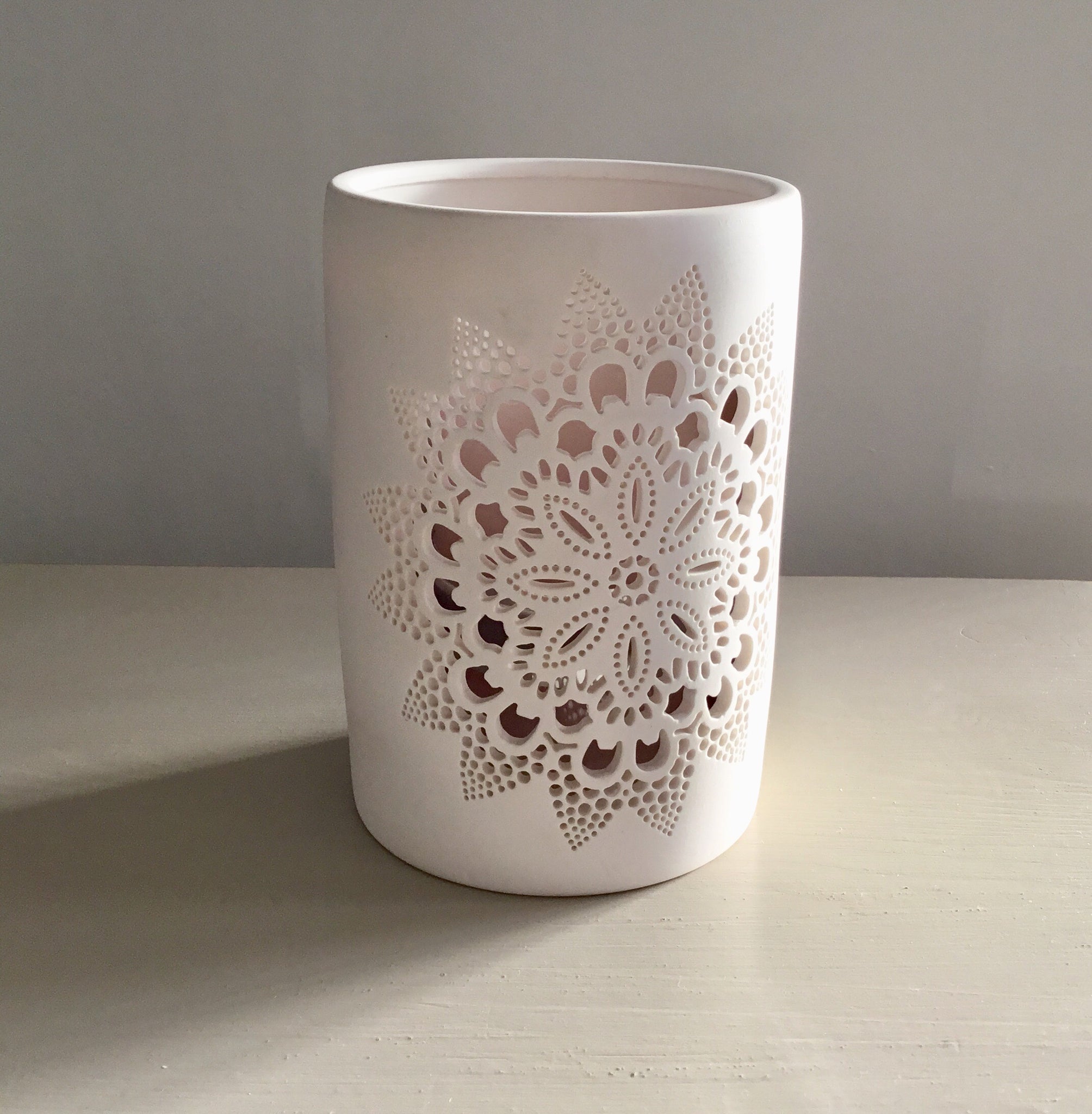 White Candle Holder with Decorative Design